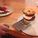 Mercer Culinary M18710RD 8" x 3" Perforated Turner w/ Red Polypropylene Handle, High Carbon Japanese Steel thumbnail 2