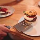 Mercer Culinary M18710WH 8" x 3" Perforated Turner w/ White Polypropylene Handle, High Carbon Japanese Steel thumbnail 2