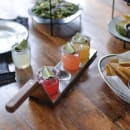 Tablecraft 20002 4 Well Spatula Style Flight Board w/ Brown Handle - 16" x 3 1/2", Stainless Steel thumbnail 9