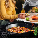 Lodge 13 1/4" Round Seasoned Cast Iron Skillet w/ Handles (L12SKL) thumbnail 7