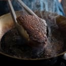 Matfer Bourgeat 062002 9 1/2" Black Steel Frying Pan w/ Riveted Strong Steel Strip Handle thumbnail 6